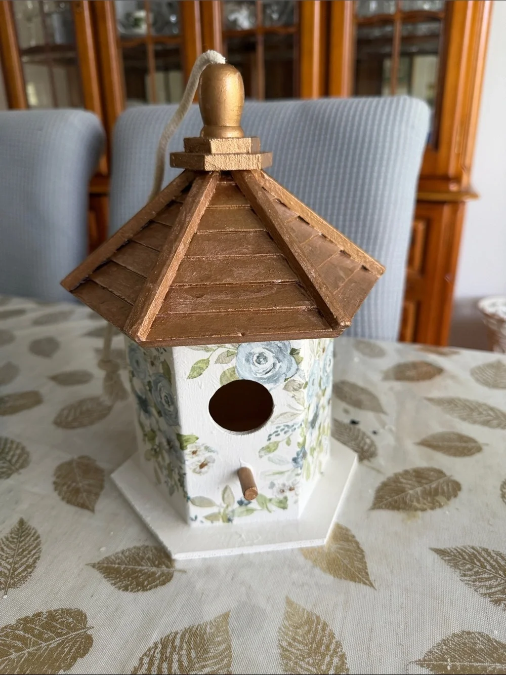 White Birdhouse with Gold Roof and Blue Floral Accents wooden